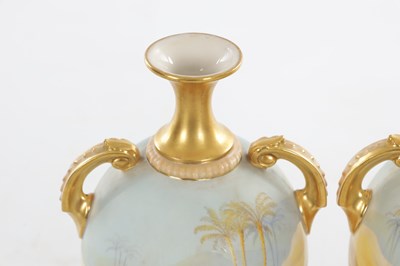 Lot 55 - A FINE PAIR OF EARLY 20TH CENTURY ROYAL WORCESTER PORCELAIN TWIN-HANDLED CABINET VASES BY JOHNSON