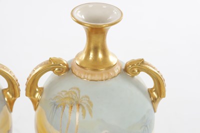 Lot 55 - A FINE PAIR OF EARLY 20TH CENTURY ROYAL WORCESTER PORCELAIN TWIN-HANDLED CABINET VASES BY JOHNSON