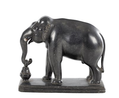 Lot 541 - AN 18TH/19TH CENTURY INDIAN BLACK PORPHYRY ELEPHANT SCULPTURE ON A STEPPED BASE