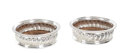 Lot 134 - A PAIR OF EARLY 19TH CENTURY ENGLISH SILVER WINE COASTERS