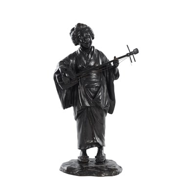 Lot 410 - A JAPANESE MEIJI PERIOD PATINATED BRONZE FIGURE OF A GEISHA WITH SHAMISEN