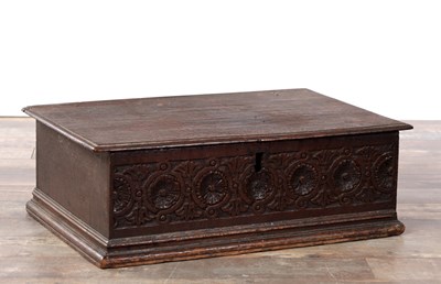 Lot 1372 - A 17TH CENTURY OAK BIBLE BOX WITH GUILLOCHE CARVED FRONT AND HINGED LID