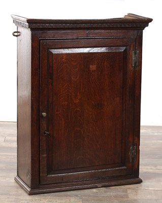 Lot 1527 - AN EARLY 18TH CENTURY OAK HANGING CUPBOARD
