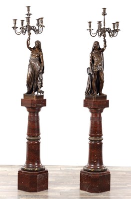 Lot 1064 - FERDINAND BARBEDIENNE A PAIR OF FINE LATE 19TH CENTURY FRENCH PATINATED BRONZE EGYPTIANESQUE FIVE-BRANCH CANDELABRA ON ROUGE MARBLE PEDESTALS