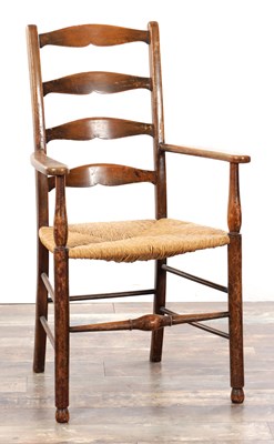 Lot 1521 - A 19TH CENTURY STAINED FRUITWOOD LADDER BACK ARMCHAIR