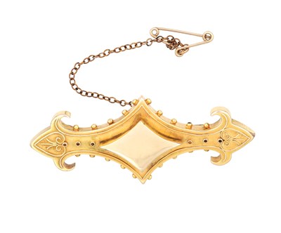 Lot 380 - A VICTORIAN 18CT YELLOW GOLD BROOCH WITH LOCKET BACK AND SAFETY CHAIN