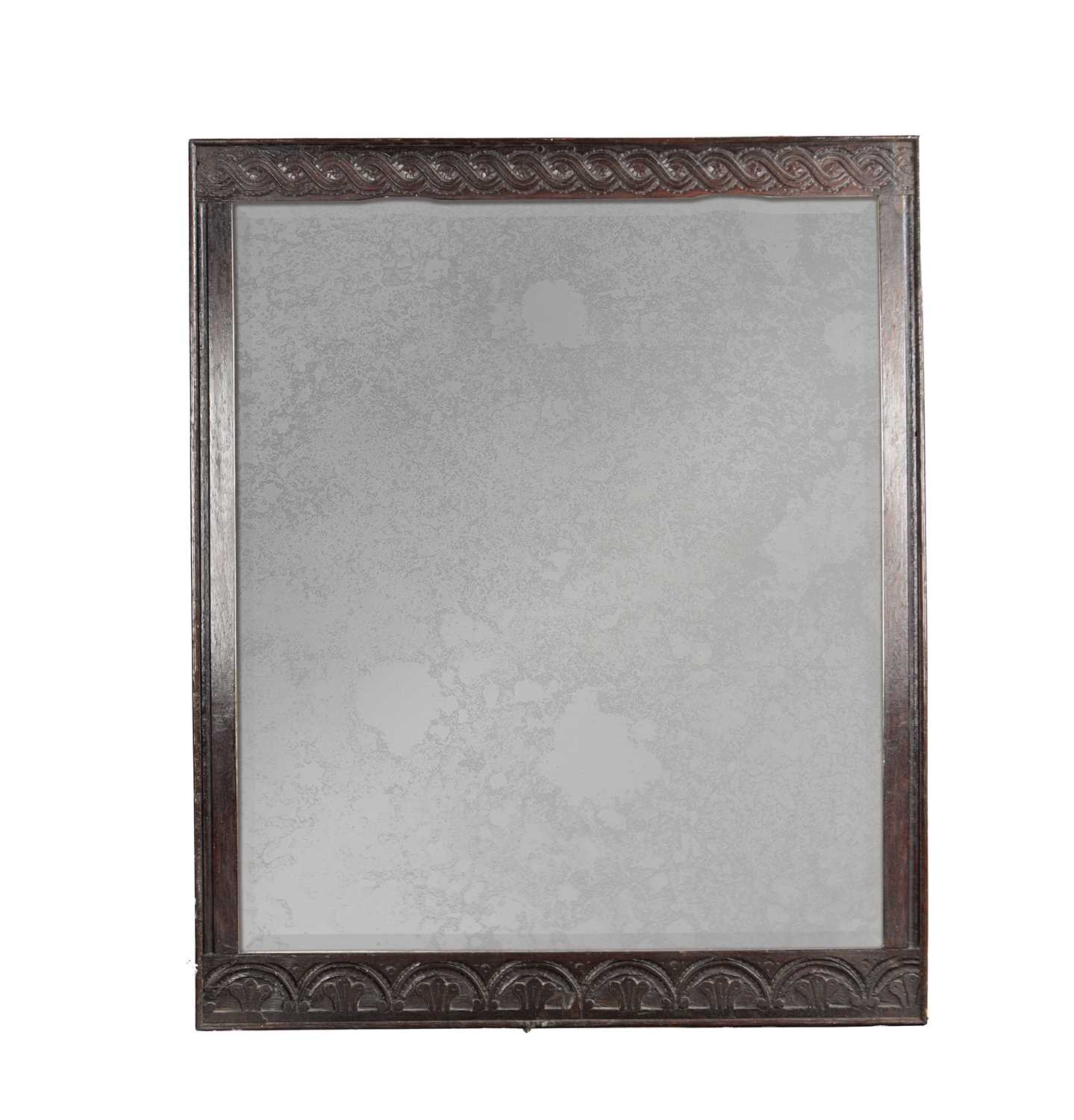 Lot 1511 - AN 18TH CENTURY STYLE CARVED OAK HANGING MIRROR