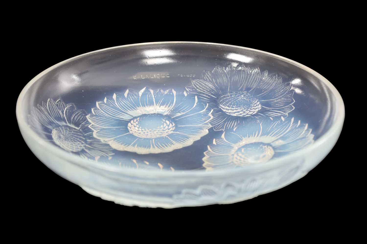 Lot 566 - RENE LALIQUE AN OPALESCENT BLUE STAINED GLASS 'VERNON' DISH