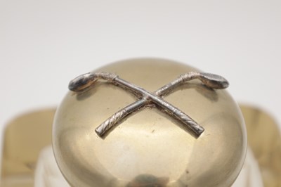 Lot 565 - A VICTORIAN CUT GLASS INKWELL WITH DOMED METAL COVER APPLIED WITH CROSSED GOLF CLUBS