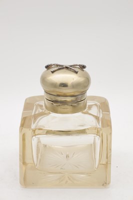 Lot 565 - A VICTORIAN CUT GLASS INKWELL WITH DOMED METAL COVER APPLIED WITH CROSSED GOLF CLUBS