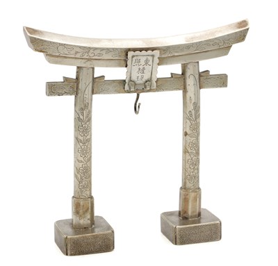 Lot 568 - A MEIJI PERIOD JAPANESE SILVER METAL POCKET WATCH HOLDER FORMED AS A TORII SHINTO GATE