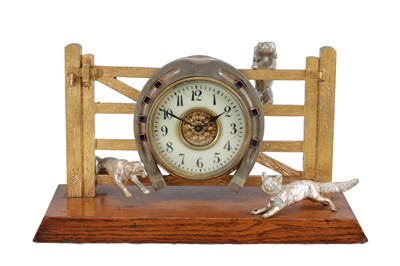 Lot 1223 - A LATE 19TH CENTURY GILT AND SILVERED BRASS FOX AND HOUNDS MANTEL CLOCK WITH HORSESHOE BEZEL ON OAK BASE