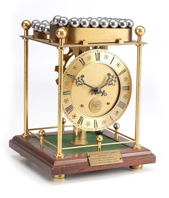 Lot 1205 - A LATE 20TH CENTURY ENGLISH BRASS SPHEROIDAL WEIGHT CLOCK BY THWAITES & REED