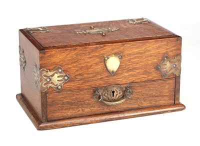 Lot 805 - A LATE 19TH CENTURY ARTS AND CRAFTS OAK HUMIDOR WITH BRASS MOUNTS