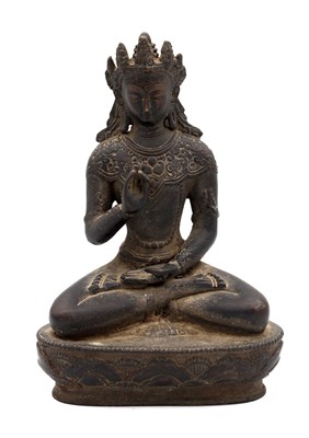 Lot 482 - A HIMALAYAN PATINATED BRONZE FIGURE OF A SEATED BODHISATTVA