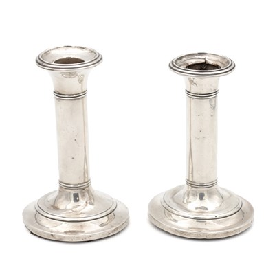 Lot 192 - A PAIR OF EDWARDIAN ENGLISH SILVER CANDLESTICKS