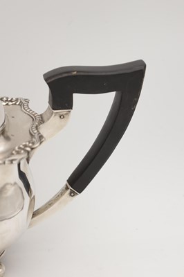 Lot 71 - AN EARLY 20TH CENTURY ENGLISH SILVER TEAPOT WITH EBONY HANDLE AND FINIAL