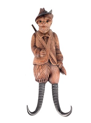 Lot 761 - A 19TH CENTURY BLACK FOREST CARVED WOOD DOG HUNTSMAN COAT HOOK WITH TWIN HORN-FORM HOOKS