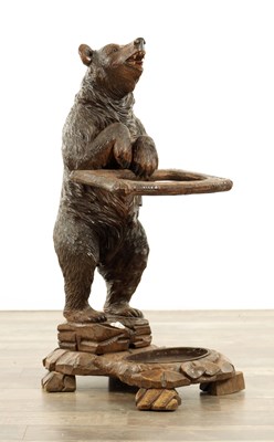 Lot 814 - A LATE 19TH CENTURY BLACK FOREST CARVED BEAR STICK STAND