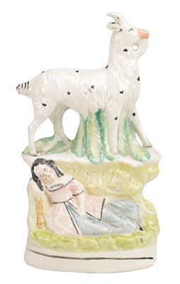 Lot 30 - A 19TH CENTURY STAFFORDSHIRE POTTERY FIGURE OF A GOAT BEFORE A RECUMBENT MAIDEN