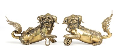 Lot 601 - A PAIR OF 17TH CENTURY CHINESE BRONZE BUDDHIST LIONS