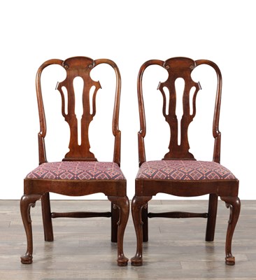 Lot 1515 - A PAIR OF GEORGE II WALNUT SIDE CHAIRS WITH VASE SPLATS AND TAPESTRY DROP-IN SEATS