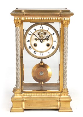 Lot 1304 - A LATE 19TH CENTURY FRENCH GILT BRASS FOUR GLASS MANTEL CLOCK