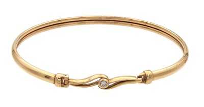 Lot 253 - A 9CT YELLOW GOLD DIAMOND BANGLE
