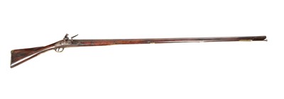 Lot 627 - A GEORGE III BRASS MOUNTED LONG FLINTLOCK FOWLING PIECE BY COMBES OF BATH