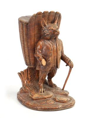 Lot 810 - A 19TH CENTURY BLACK FOREST CARVED WOOD TOBACCO BOX MODELLED AS A STANDING FOX