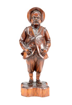Lot 809 - A 19TH CENTURY BLACK FOREST CARVED PINE FIGURE OF A GENTLEMAN