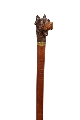Lot 846 - A 19TH CENTURY BLACK FOREST CARVED LINDEN WOOD DOG'S HEAD WALKING STICK