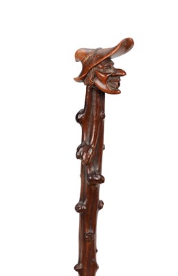 Lot 863 - A 19TH CENTURY BLACK FOREST WALKING STICK WITH CARVED LINDEN WOOD WITCH'S HEAD HANDLE