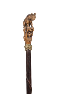 Lot 841 - A 19TH CENTURY BLACK FOREST LINDEN WOOD WALKING STICK WITH CAT FINIAL
