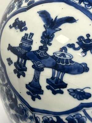Lot 522 - A PAIR OF KANGXI PERIOD CHINESE BLUE AND WHITE BALUSTER VASES AND COVERS