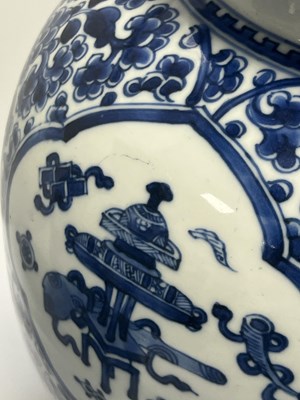 Lot 522 - A PAIR OF KANGXI PERIOD CHINESE BLUE AND WHITE BALUSTER VASES AND COVERS
