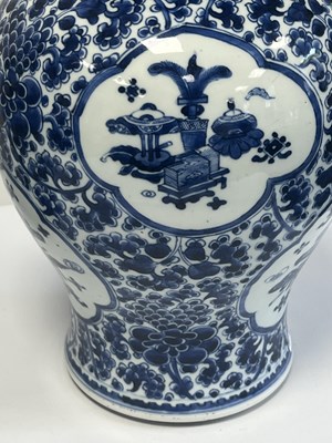Lot 522 - A PAIR OF KANGXI PERIOD CHINESE BLUE AND WHITE BALUSTER VASES AND COVERS
