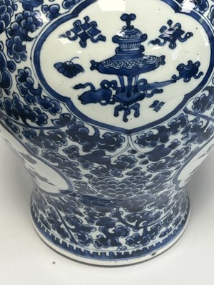 Lot 522 - A PAIR OF KANGXI PERIOD CHINESE BLUE AND WHITE BALUSTER VASES AND COVERS