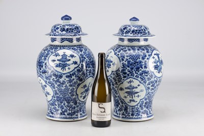 Lot 522 - A PAIR OF KANGXI PERIOD CHINESE BLUE AND WHITE BALUSTER VASES AND COVERS