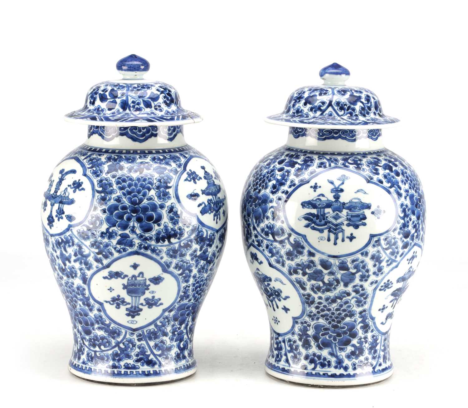 Lot 522 - A PAIR OF KANGXI PERIOD CHINESE BLUE AND WHITE BALUSTER VASES AND COVERS