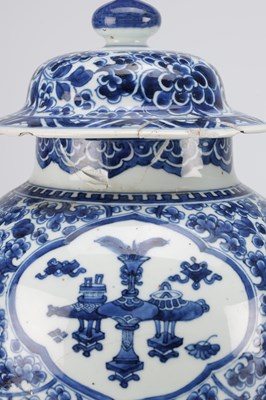 Lot 522 - A PAIR OF KANGXI PERIOD CHINESE BLUE AND WHITE BALUSTER VASES AND COVERS