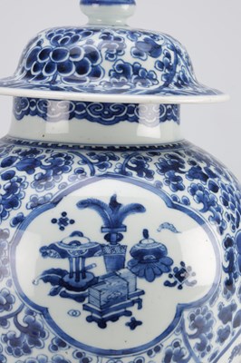 Lot 522 - A PAIR OF KANGXI PERIOD CHINESE BLUE AND WHITE BALUSTER VASES AND COVERS