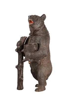Lot 789 - A 19TH CENTURY BLACK FOREST CARVED LINDEN WOOD TOBACCO JAR FORMED AS A STANDING BEAR