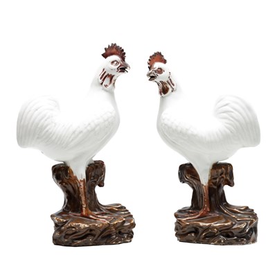 Lot 483 - A PAIR OF 18TH/19TH CENTURY CHINESE EXPORT PORCELAIN ROOSTERS ON BROWN GLAZED ROCKWORK BASES