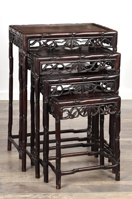 Lot 427 - A SET OF FOUR 19TH CENTURY CHINESE CARVED HARDWOOD NEST OF TABLES