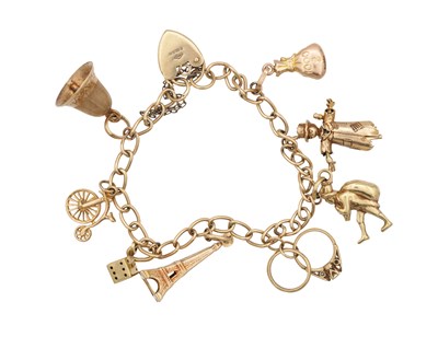 Lot 237 - A 9CT YELLOW GOLD CHARM BRACELET WITH HEART PADLOCK CLASP