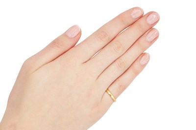 Lot 318 - A MID 20TH CENTURY 22CT YELLOW GOLD BAND