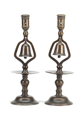Lot 917 - A PAIR OF 19TH CENTURY BRONZE TAVERN CANDLESTICKS