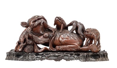 Lot 435 - A LARGE 19TH CENTURY CHINESE CARVED HARDWOOD MODEL OF A RECUMBENT BUDDHISTIC LION WITH CUBS ON STAND
