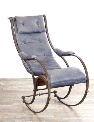 Lot 1425 - ATTRIBUTED TO R. W. WINFIELD, A 19TH CENTURY ENGLISH CAST IRON AND LEATHER UPHOLSTERED ROCKING ARMCHAIR